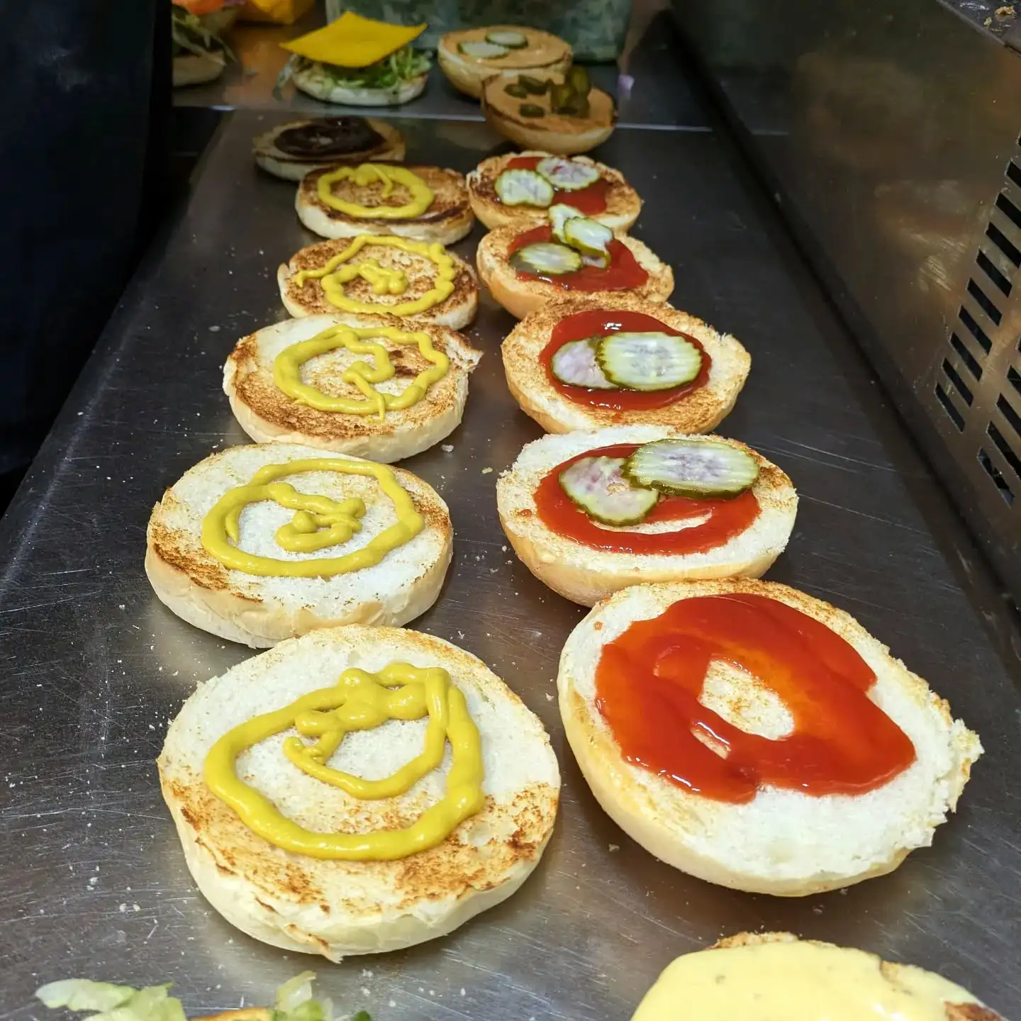 Toasted milk buns lined up with mustard and ketchup