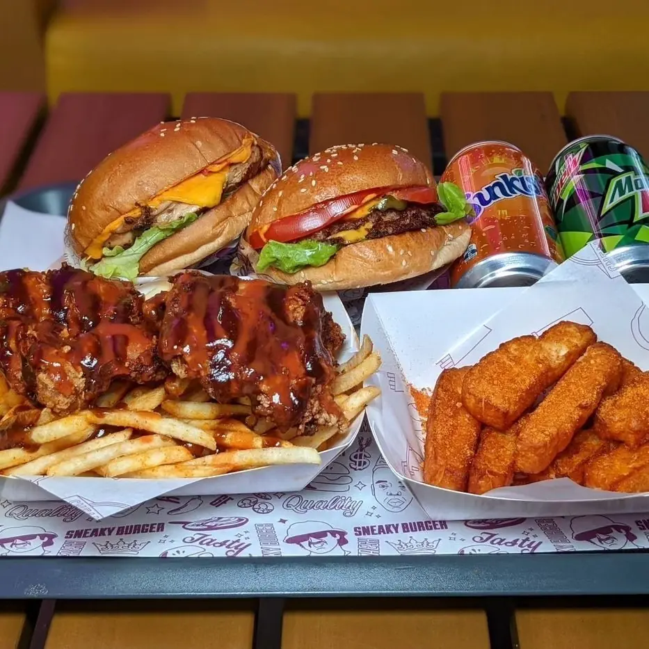 Sneaky bacon cheeseburger stacked high with lettuce and tomato